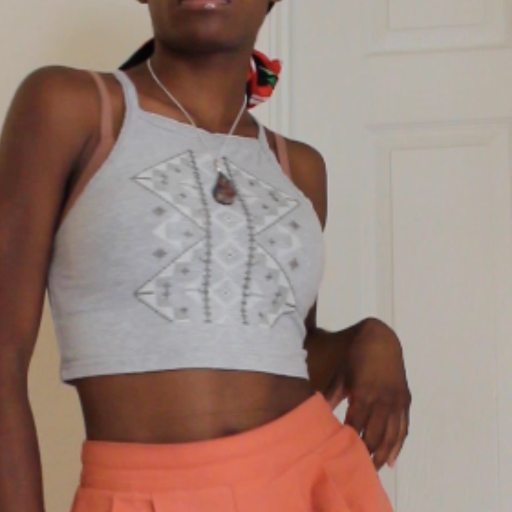 Cropped grey top with detailed embroidery